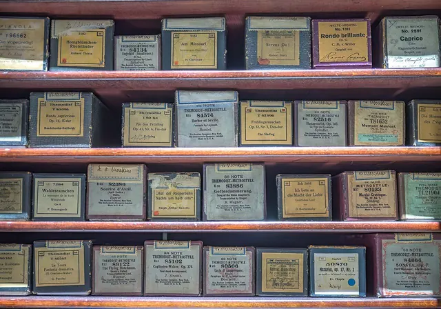 Collection of piano rolls in their original boxes in Collections of the Deutsches Museum