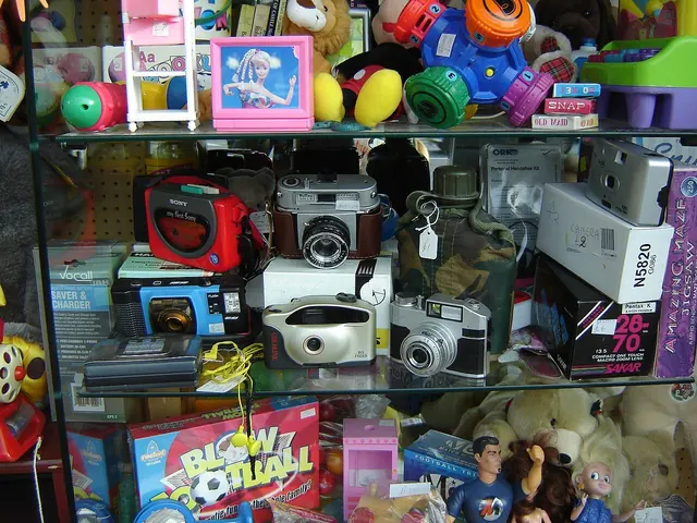 Bags of donated clothes at a charity shop counter