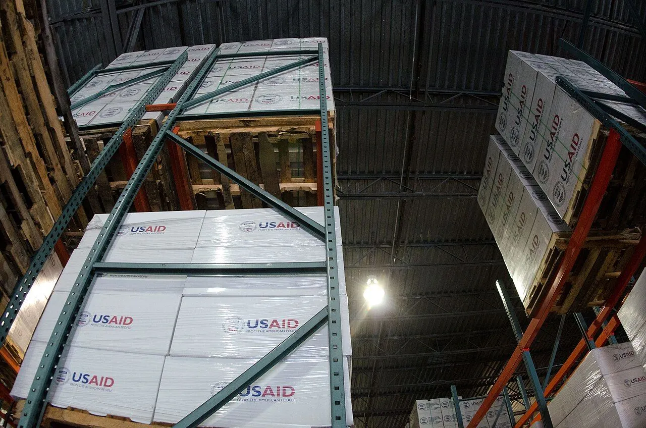 Aid workers unloading relief supplies after a disaster